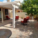 Outdoor furniture on shaded patio